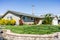 Exterior view of single-family detached home on a corner lot in a residential neighborhood; South San Francisco Bay Area,