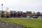 Exterior view of a strip mall shopping center and parking lot of small stores in the Arbor