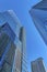 Exterior view of towering apartments with glass facade against clear blue sky