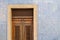 Exterior wall of a residential building with traditional portuguese tiles and entrance door in the Bairro Alto district in the old