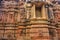 Exterior wall of temple ruins and beautifully carved stone sculpture of Hindu and Jain religion