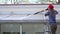 Exterior washing and building cleaning glass roof with high pressure water jet.