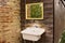 An external sink under a mirror in the garden of a farmhouse in the countryside Umbria, Italy