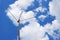 External television antenna on a background of bright blue sky and cotton clouds. Shot in the summer in the country. Vivid