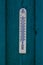 The external thermometer on a blue green background