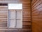 The external wood window and wall of a vintage wood house