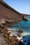 Extinct volcano crater, sharp basalt boulders