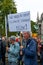 Extinction Rebellion protester with campaign placard at Trafalgar Square London UK. sign