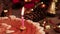 Extinguished candle in chocolate cake near Christmas decoration