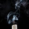 Extinguished candle with smoke