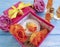 extract, essence gift box cosmetic cream beautiful fresh orange rose on a blue wooden background