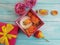 Extract, essence gift box cosmetic product moisturiz bow composition cream beautiful fresh orange rose on a blue wooden background