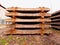 Extracted old concrete sleepers in stock. Old rusty used concrete railway ties stored