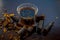 Extracted water of garmalo or indian shower tree in a glass bowl on wodoen surface with sugar and raw garmalo or amaltas.