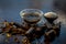 Extracted water of garmalo or indian shower tree in a glass bowl on wodoen surface with sugar and raw garmalo or amaltas.