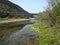 Extraordinarily beautiful mountains, green forests, rivers and bridges against the sky