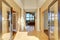 Extraordinary hallway entrance with hardwood floors, and white b