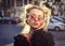 Extravagant blonde girl in rose glasses