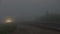 Extremal driving. Cars moving into and out of the thick fog with front, rear, fog lights and stop signal on