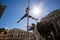 Extreme athletes hanging on street sign