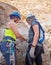 Extreme athletes are preparing to descending with equipment for rappel in mountains of Judean Desert, near Rahaf stream, near