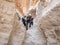 Extreme athletes are preparing to descending with equipment for rappel in mountains of Judean Desert, near Rahaf stream, near