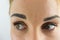 Extreme close-up of attractive caucasian girl eyes looking to the side