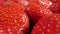 extreme close-up of a bunch of ripe strawberries, detailed