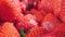 extreme close-up of a bunch of ripe strawberries, detailed