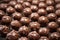 extreme close-up of cooling chocolate covered nuts