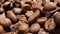 Extreme close-up of detailed coffee beans and bittersweet chocolate chunks with whole hazelnuts