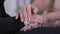 Extreme close-up of female Caucasian hands caressing Muslim woman`s palms. Two different female friends supporting each