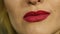 Extreme close up of lip. Woman pursing her lips in a seductive gesture. slow motion