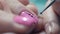 Extreme Close-up, Manicure Master Decorates Woman`s Nail in Beauty Salon