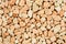 Extreme close up natural stone carpet, beige and cream coloured in different shades and tints of beige. Decorative stone coating.