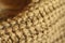 Extreme close-up ocher color knitted natural wool sweater texture, wavy folds, selective focus