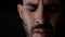 Extreme close up portrait of sad and depressed man. Caucasian man crying face