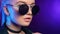 Extreme close up portrait of trendy clubber female in black sunglasses. Shot with RED camera in 4K