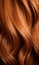 Extreme close-up shot of hair texture, with slight curves brown with copper highlights