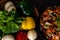 Extreme Close up shot of tasty Chilli chicken along side colorful vegetables