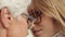 Extreme close up shot of young and senior woman touching foreheads