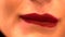 Extreme close up of woman biting her lower lip