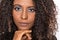 Extreme closeup of afro hairstyle black woman looking confident at camera with serious expression