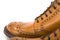 Extreme Closeup of Mens Tanned Brogue Leather Boots with Rubber Sole