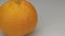 Extreme closeup orange mandarin in drops of dew