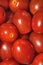 Extreme closeup of ripe cherry tomatoes, vertical aspect