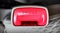 Extreme closeup shot of a car seatbelt red press button