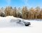 Extreme driving, the car is moving rapidly over the smooth snow and creates a spray of snow