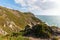 Extreme long shot of a lighthouse Cabo da Roca, Portugal, situated on the top of a rocky cliff