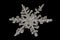 Extreme magnification - Real snowflake on black background